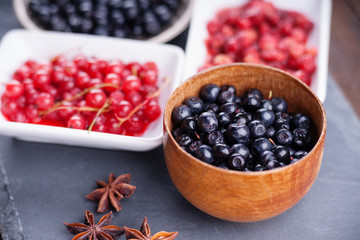 Berry fruits in bowls and dishes