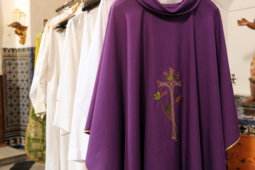 Inside the sacristy of a Catholic church, chasubles