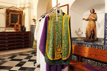 Chasubles, inside the sacristy of a Catholic church - obrazy, fototapety, plakaty