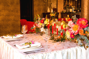 Decorated table, vases of flowers. Close up. Wedding concept