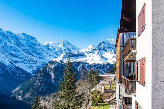Fototapeta Snow mountains view from hotel windows or balcony in Murren, Switzerland