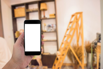 man hand holding the phone and white screen with blur background