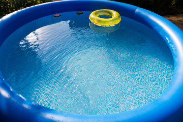 Outdoor blue inflatable pool with water
