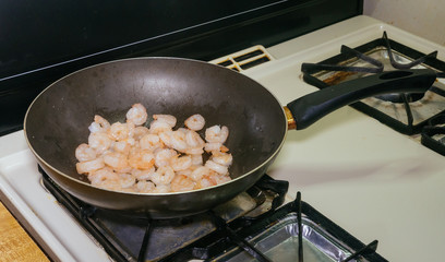 cooking shrimp in a pan kitchen at the restaurant