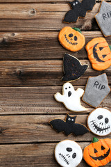 Fresh halloween gingerbread cookies on brown wooden table
