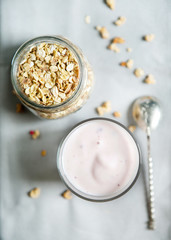 Healthy breakfast of cereal and yogurt, on a gray background