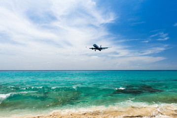 airplane landing over the sea