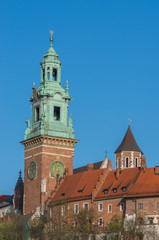 Fototapeta premium Towers of Wawel cathedral over Wawel castle on sunny afternoon