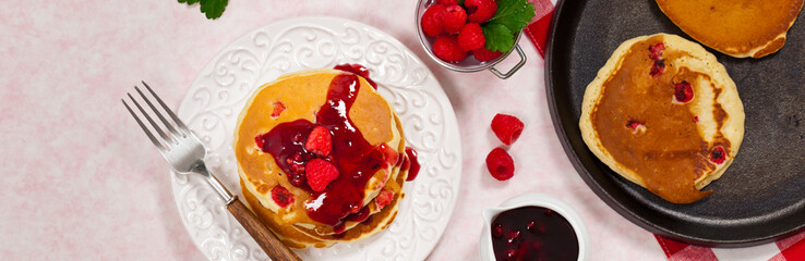Pancakes with Raspberry Sauce for breakfast. Selective focus.