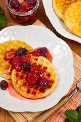 Waffles with Fresh Strawberry Syrup. Selective focus.