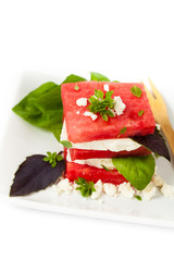 Watermelon Salad with Feta isolated on white. Selective focus.