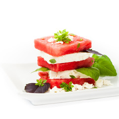 Watermelon Salad with Feta isolated on white. Selective focus.