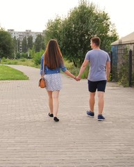 young couple holding hands