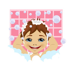 little boy washing his hair with soap foam and bubbles in bathroom