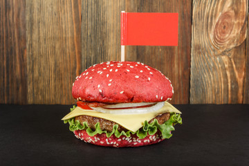 Red cheeseburger with flag close-up