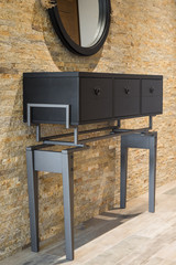 Vanity against brickwall old fashioned dressing table in home interior against brick wall