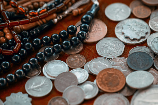 old coins and beads on countertop in antique bazaar