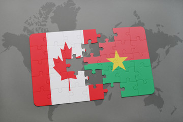 puzzle with the national flag of canada and burkina faso on a world map background.