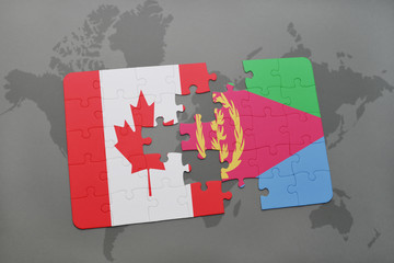 puzzle with the national flag of canada and eritrea on a world map background.