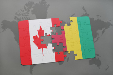 puzzle with the national flag of canada and guinea on a world map background.