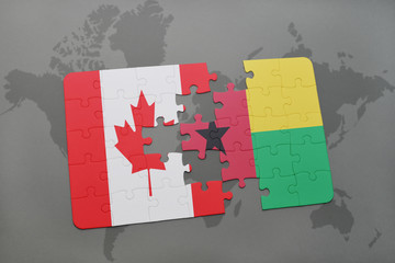 puzzle with the national flag of canada and guinea bissau on a world map background.