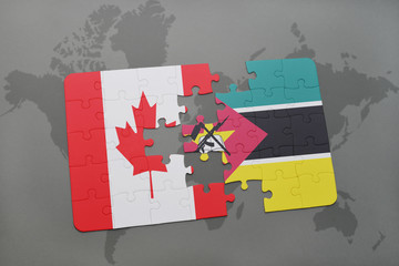puzzle with the national flag of canada and mozambique on a world map background.
