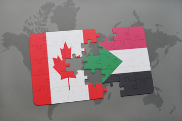 puzzle with the national flag of canada and sudan on a world map background.