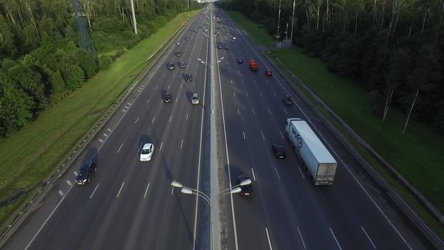 Aerial View of Traffic on a Motorway Ring Road Through a Wooded Area