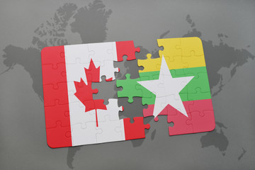 puzzle with the national flag of canada and myanmar on a world map background.