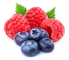 Three ripe raspberries with green leaves and five blueberries isolated on white background with clipping path