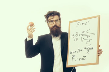 bearded man with einstein formula and newtons law