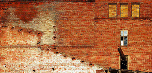 Red brick wall of old abandoned factory
