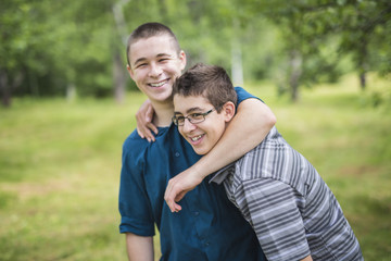 cute brothers outside in forest