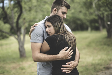 Happy loving young couple at the park