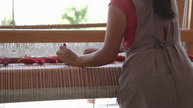 weaving in a traditional textiles factory