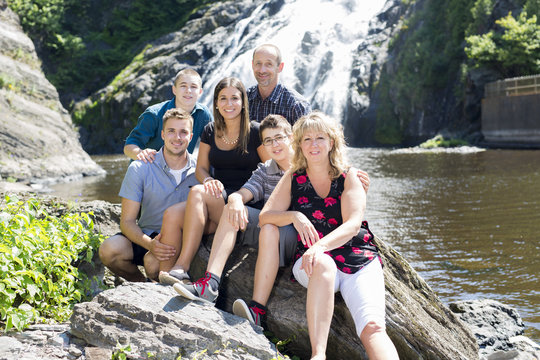 family waterfall having great time