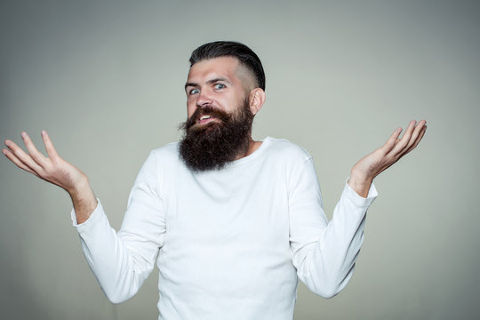 Bearded man with raised hands