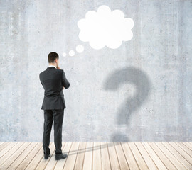 Man with question and thought cloud