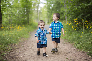 Children play outdoors on a sunny summer day.