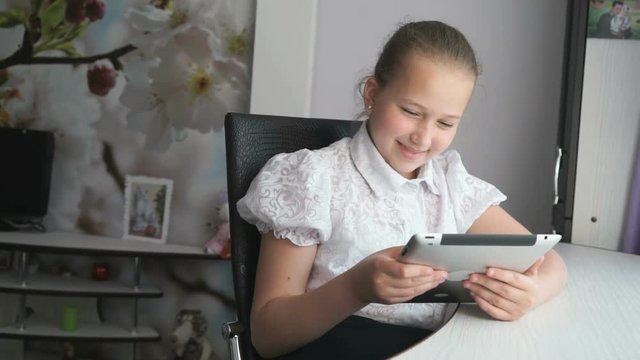 Teenager girl holding a digital tablet computer