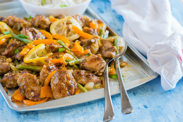 Chicken stir fry with peppers, green beans, lemons