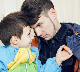 young handsome father with his son fooling around at home, lifestyle people concept