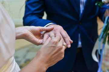 Fototapeta premium He Put the Wedding Ring on Her