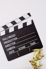 Naklejka premium Theatrical mask and film clapper