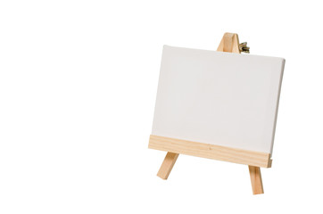 Blank canvas on easel for painting.