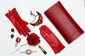flat lay feminini red clothes and accessories collage on white background.