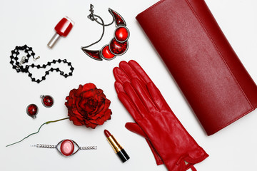 flat lay feminini red clothes and accessories collage on white background.