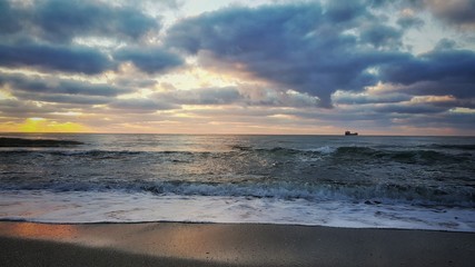 Dramatic cloudscape over the sea, sunrise shot