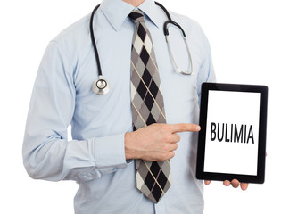 Doctor holding tablet - Bulimia