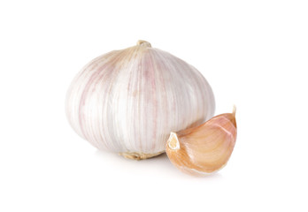 uncooked whole garlic with shell on white background